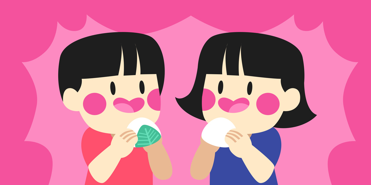 two kids eating mochi together